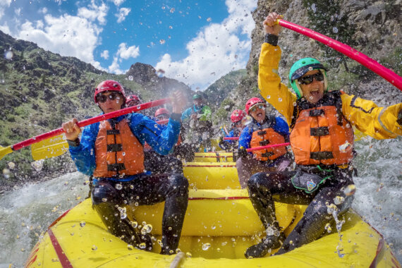 A group of paddlers splash through a rapid on the Middle Fork of the Salmon River in Idaho.