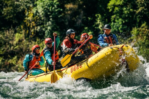 A group of whitewater rafting guides training on the American River.