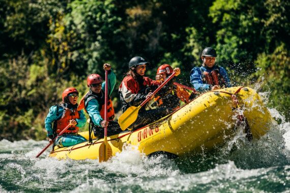 A group of whitewater rafting guides training on the American River.