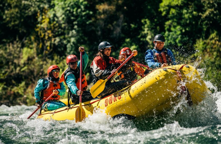 A group of whitewater rafting guides training on the American River.