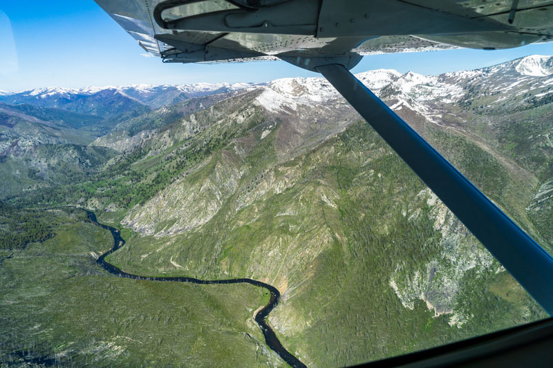 A plane flies over Idaho's Salmon River in the Frank Church Wilderness