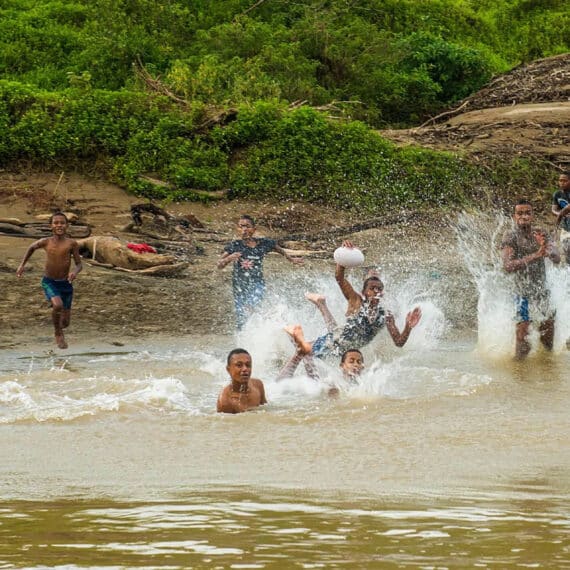 Kids playing in the river in Fiji.