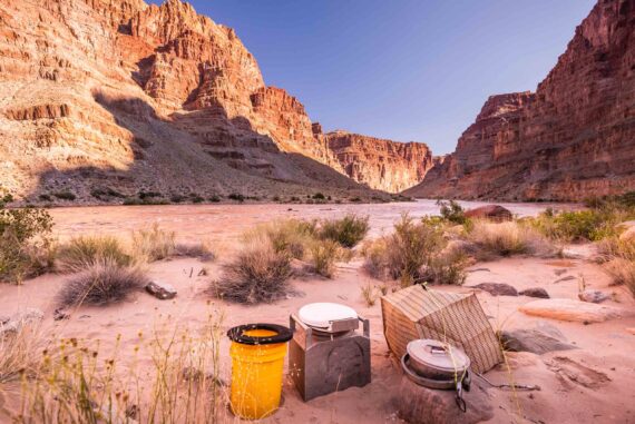 portable toilet sitting outside in a canyon.