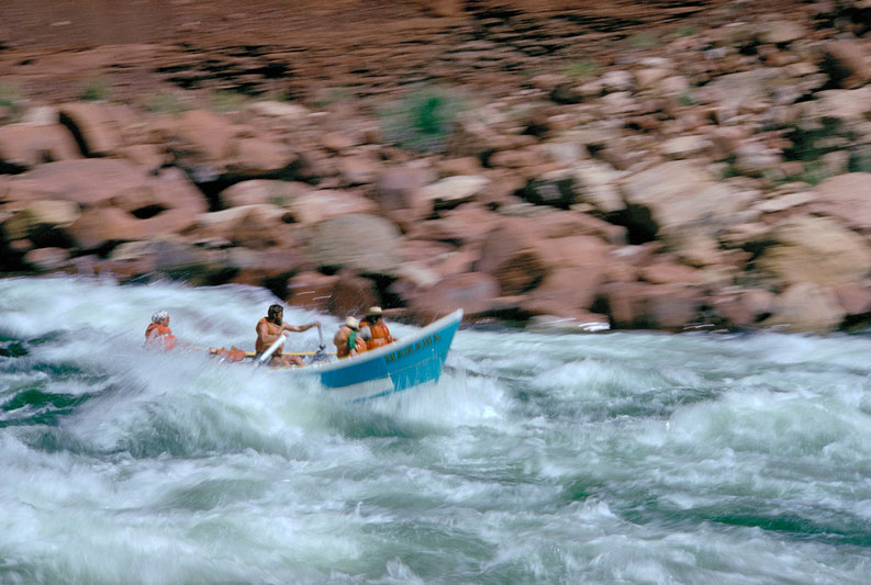 Longtime Grand Canyon river guide Regan Dale rowing a dory