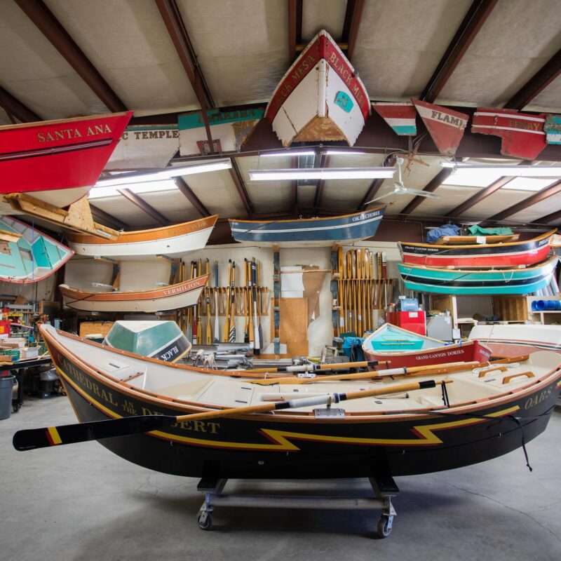 A dory sits in the OARS Grand Canyon Dories boathouse