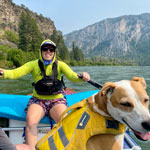 Portrait of Emma Walker and her dog on the river