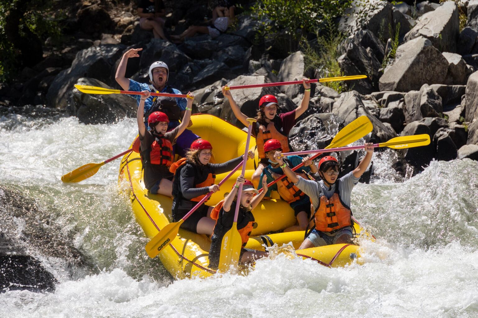 An OARS raft goes down Troublemaker rapid on the South Fork of the American River.