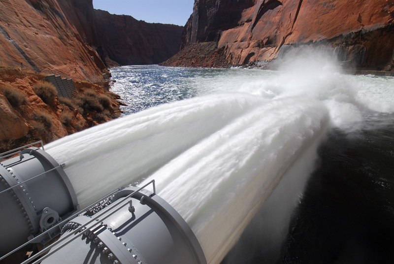 Glen Canyon Dam jet tubes releasing water into the Colorado River for a high flow experiment. Credit: USGS