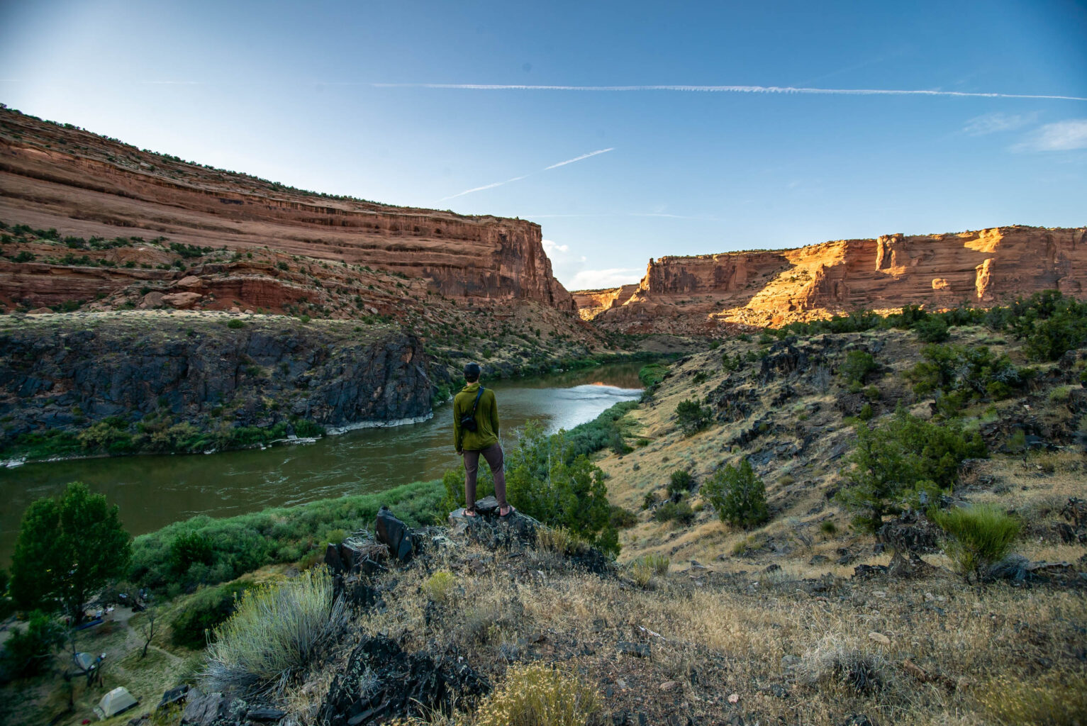 Person overlooking the river at Canyonlands.