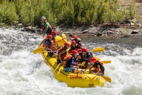 An OARS guide leads a boat down a rapid on the South Fork of the American River