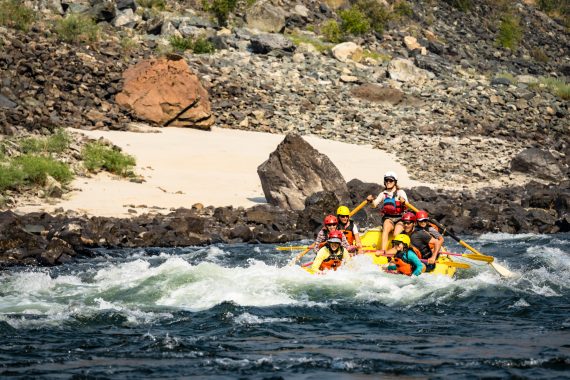 An OARS raft goes through a rapid on the Lower Salmon River