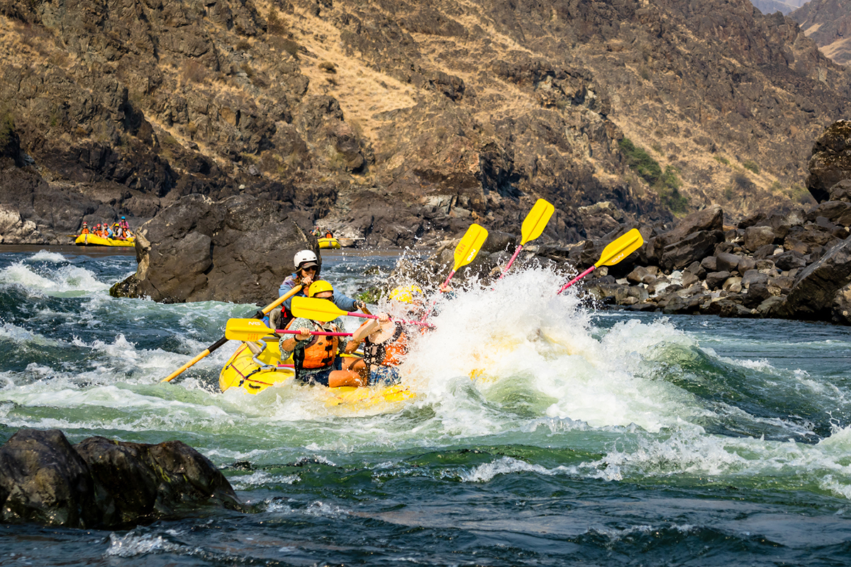 Mia guides a paddle raft through a splashy rapid on the Lower Salmon River