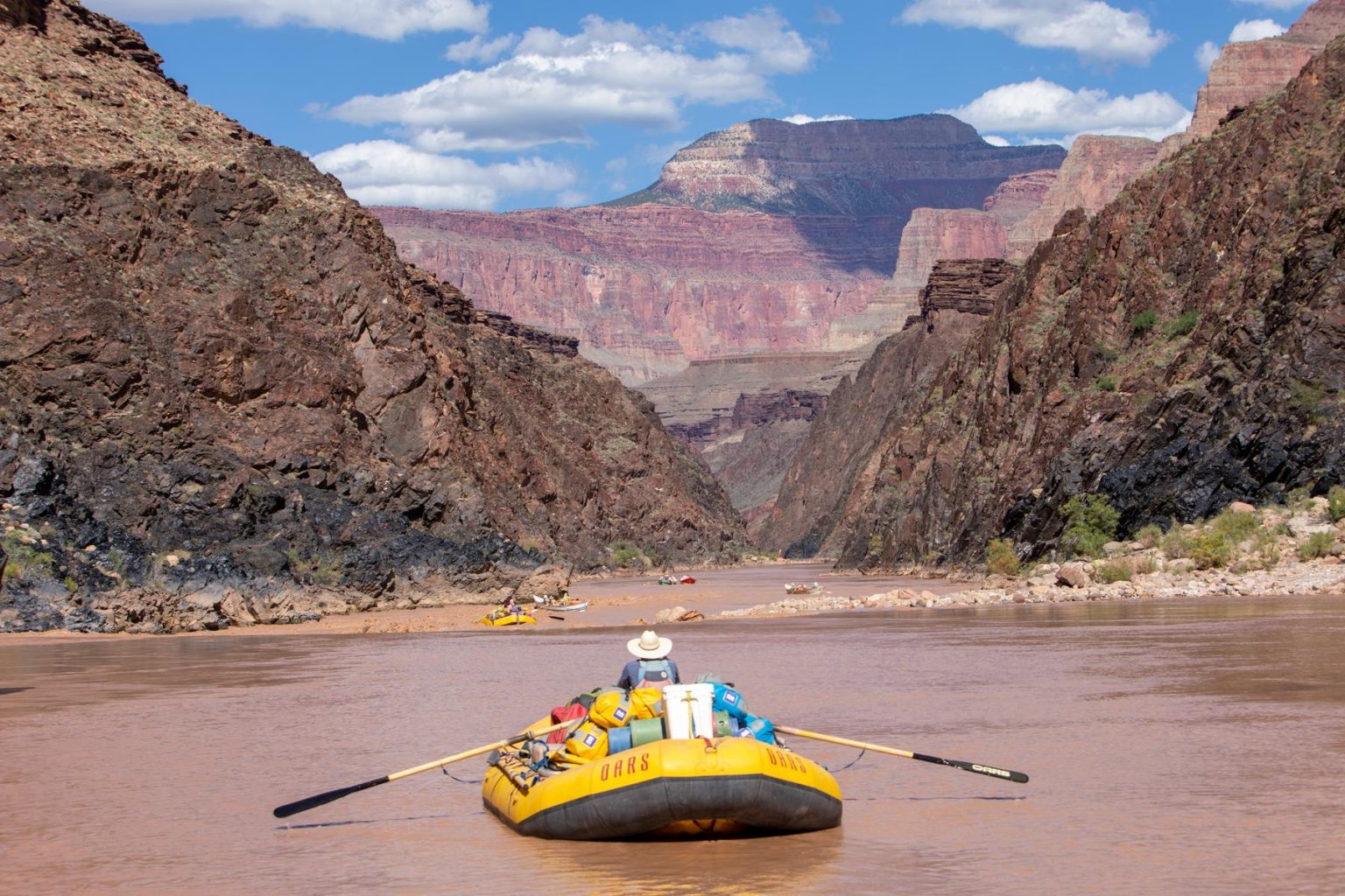 A rafter floats down the Grand Canyon on the Colorado River
