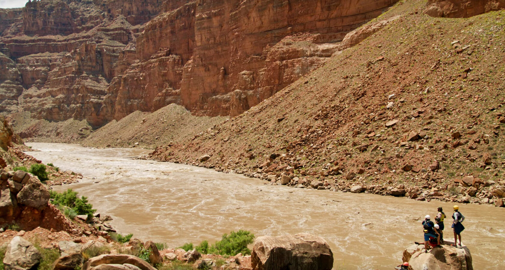 A group of river guides scouting the Big Drops in Cataract Canyon