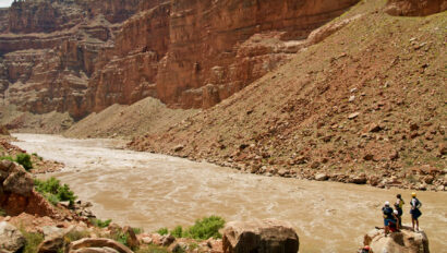 A group of river guides scouting the Big Drops in Cataract Canyon