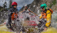 A pair of OARS guests gets splashed on the Middle Fork Salmon River rafting trip.