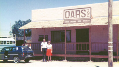 Pam and George Wendt stand in front of the OARS office in Angels Camp in the early days of the company