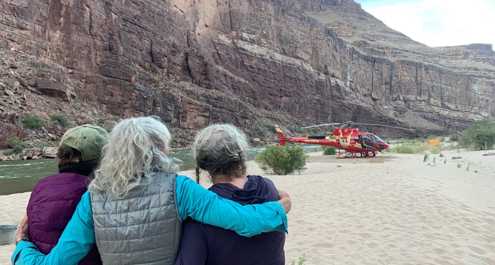 A helicopter lands at Nevills Beach in Grand Canyon to evacuate the author