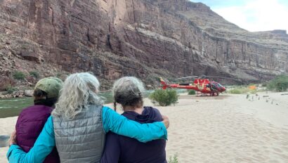 A helicopter lands at Nevills Beach in Grand Canyon to evacuate the author