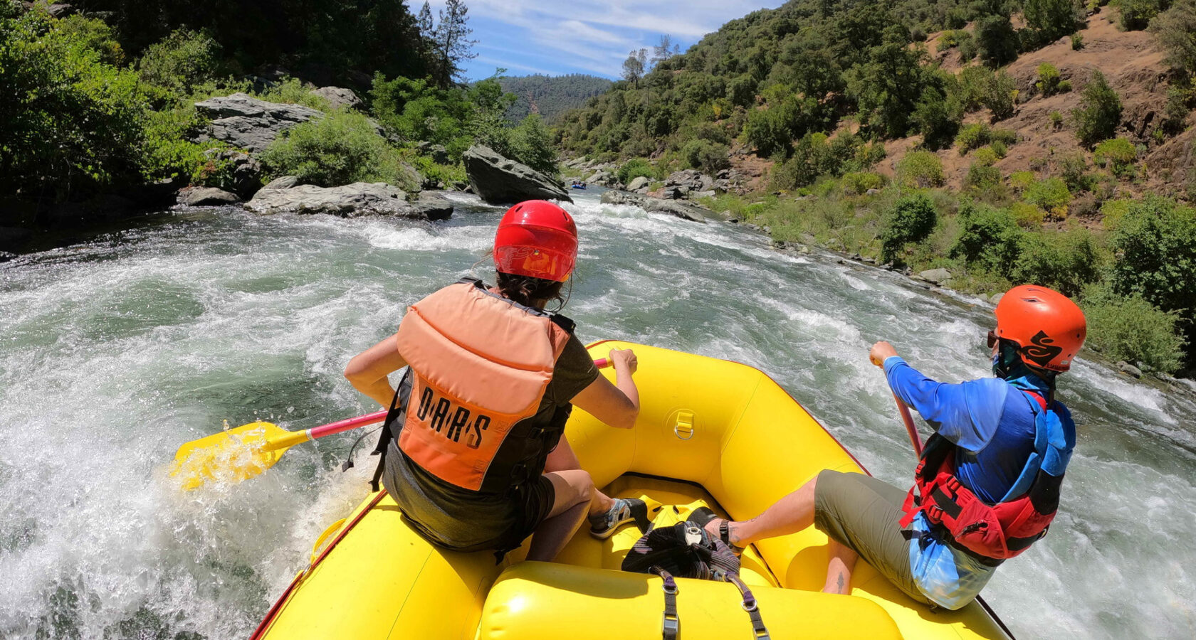 A couple navigates rapids on California's American River