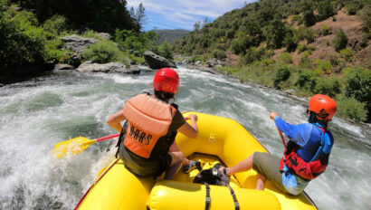 A couple navigates rapids on California's American River