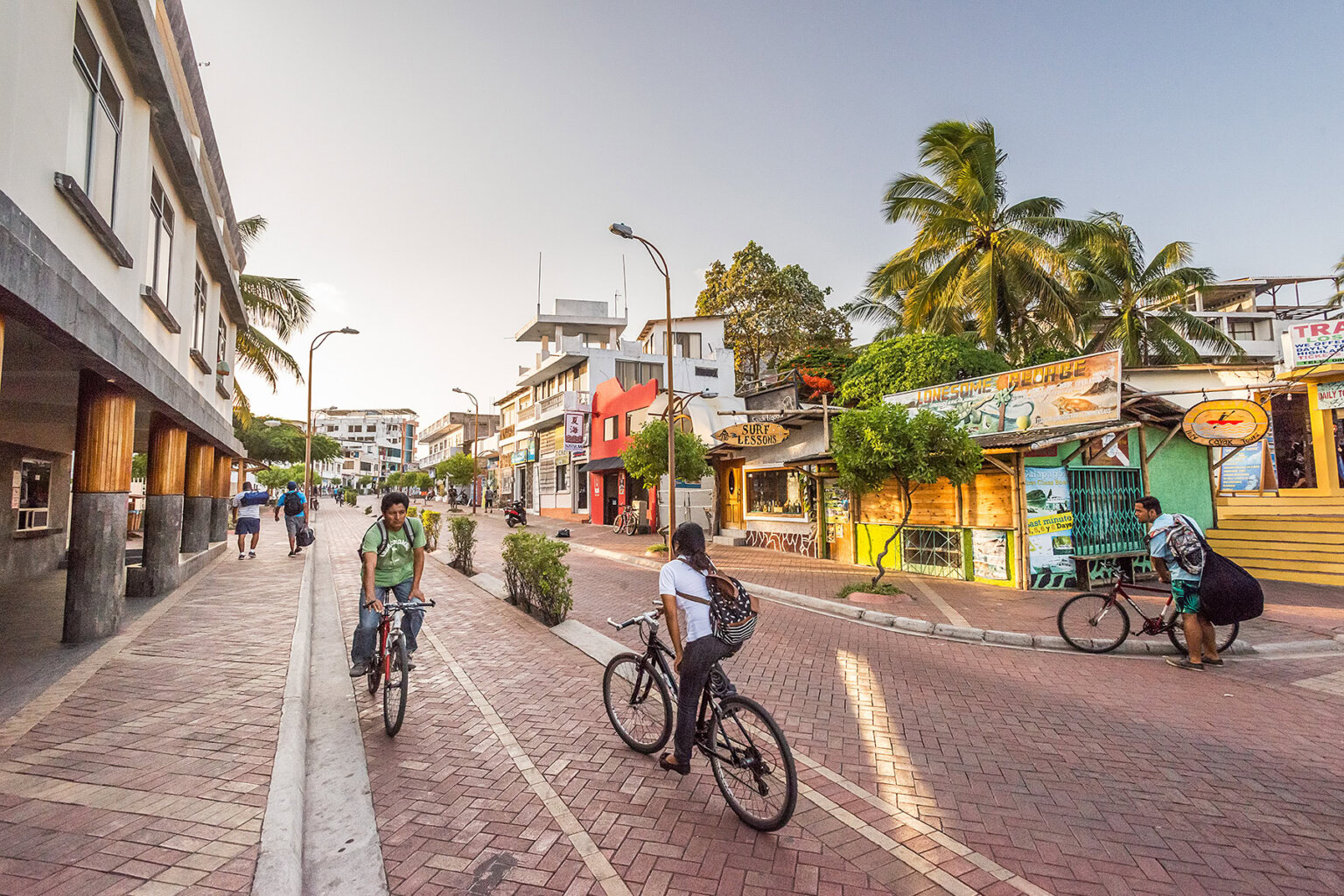 Downtown Puerto Ayora with locals on bikes, Galapagos Islands