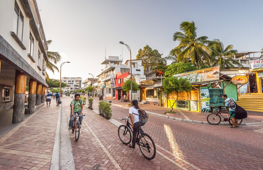 Downtown Puerto Ayora with locals on bikes, Galapagos Islands