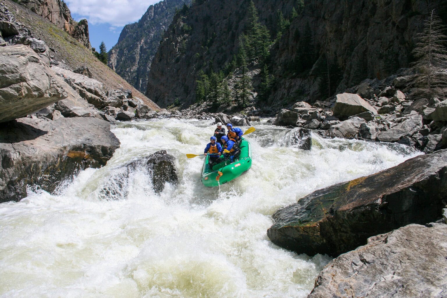 Paddlers take on Gore Canyon's Class V Tunnel Rapid along the Colorado River.
