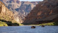 Dories row down the Colorado River in Grand Canyon