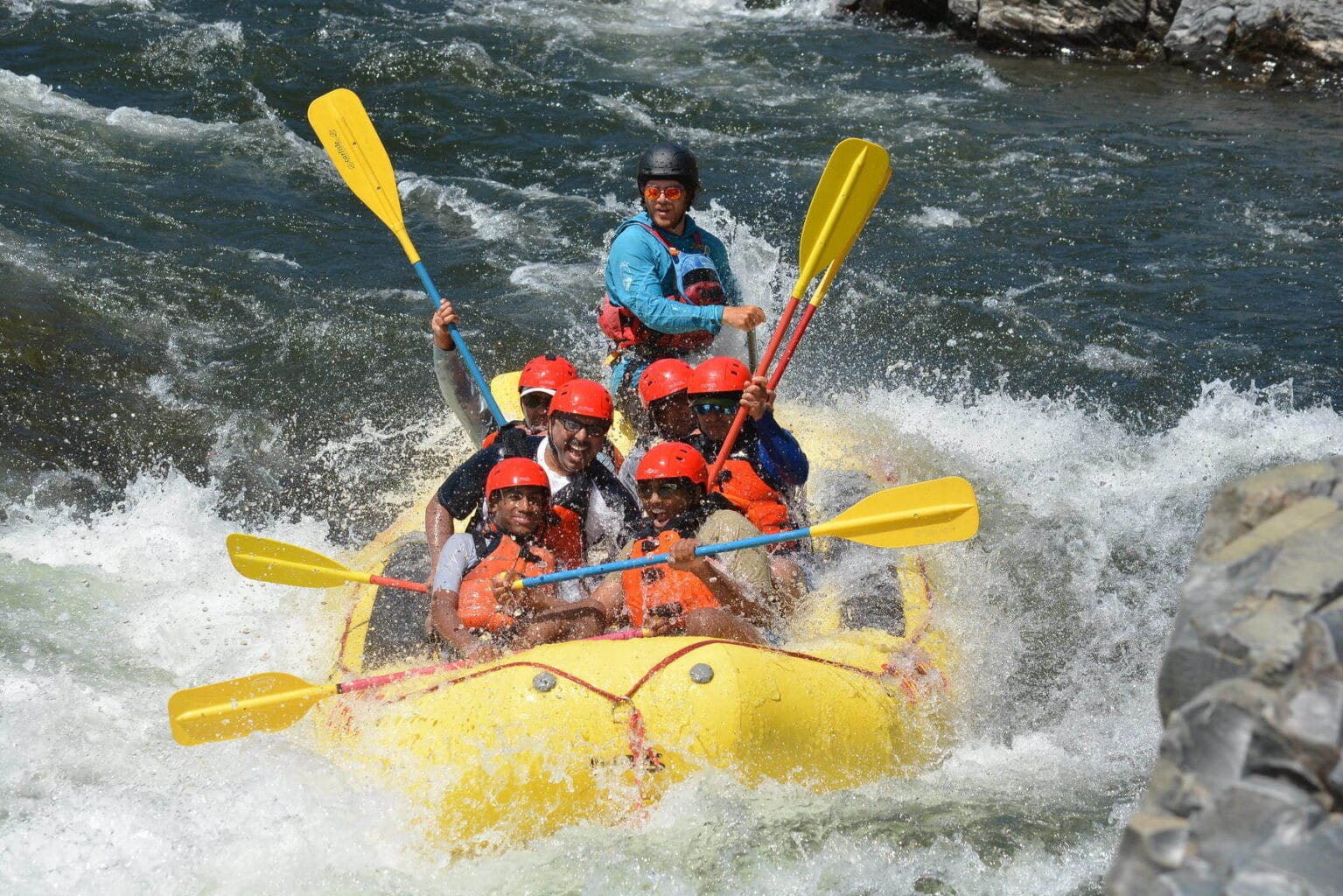 A group of rafters splash through Satan's Cesspool one of the highlight rapids on the South Fork of the American River. 