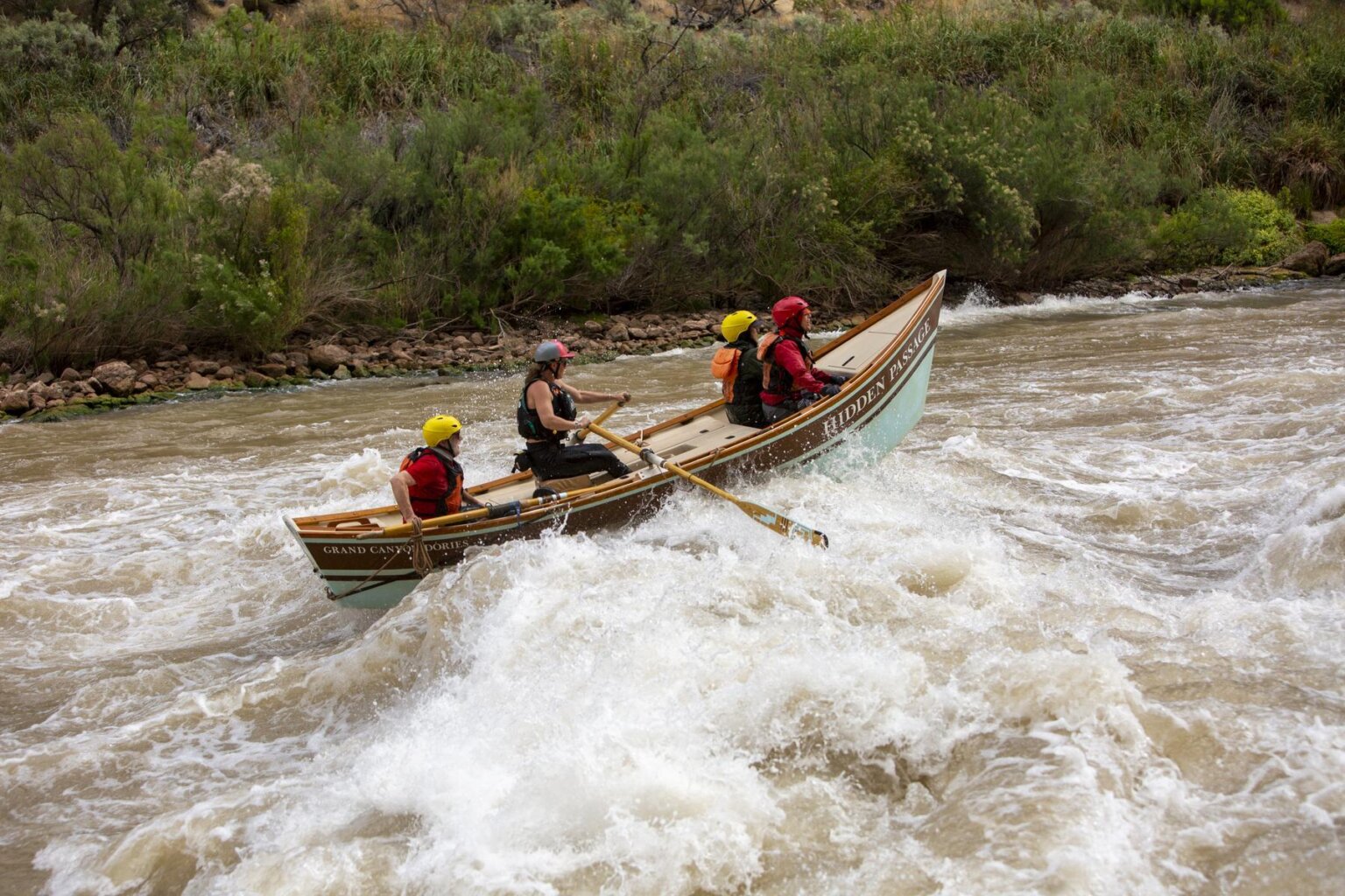 A dory goes through Lava Falls rapid on the Colorado River through Grand Canyon