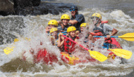 A group of rafters splashes through a rapid on the Rio Grande River in New Mexico.