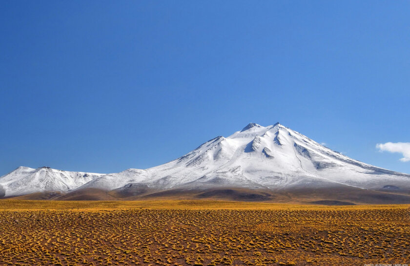 A photo of Chile's high desert and a snowy mountain peak