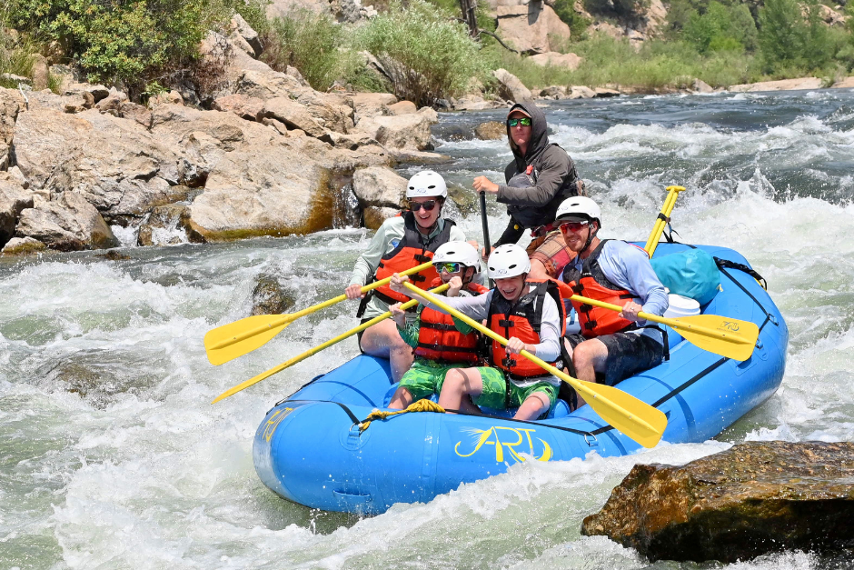 A group of rafters laugh as they paddle through Browns Canyon in Colorado.