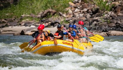 Rafters paddling through splasy whitewater in Utah's Split Mountain Canyon on the Green River