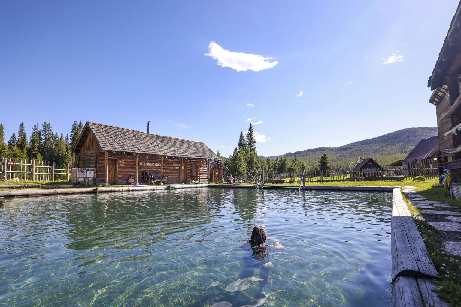 A woman soaks in Burgdorf Hot Springs