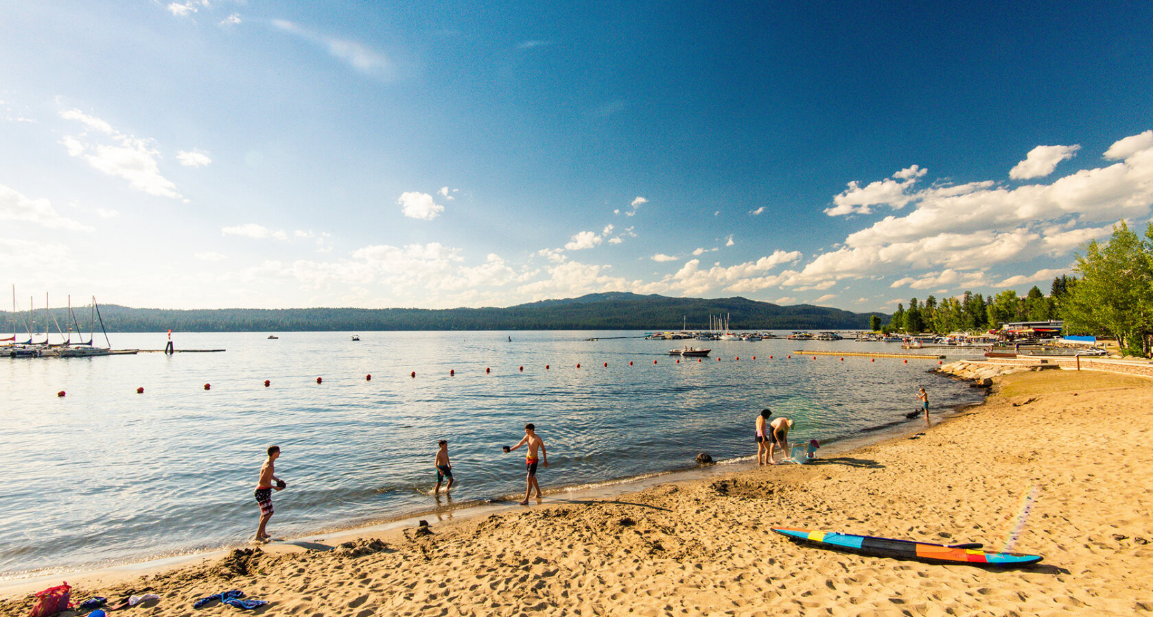 Kids playing on the beach at Legacy Park in McCall, Idaho
