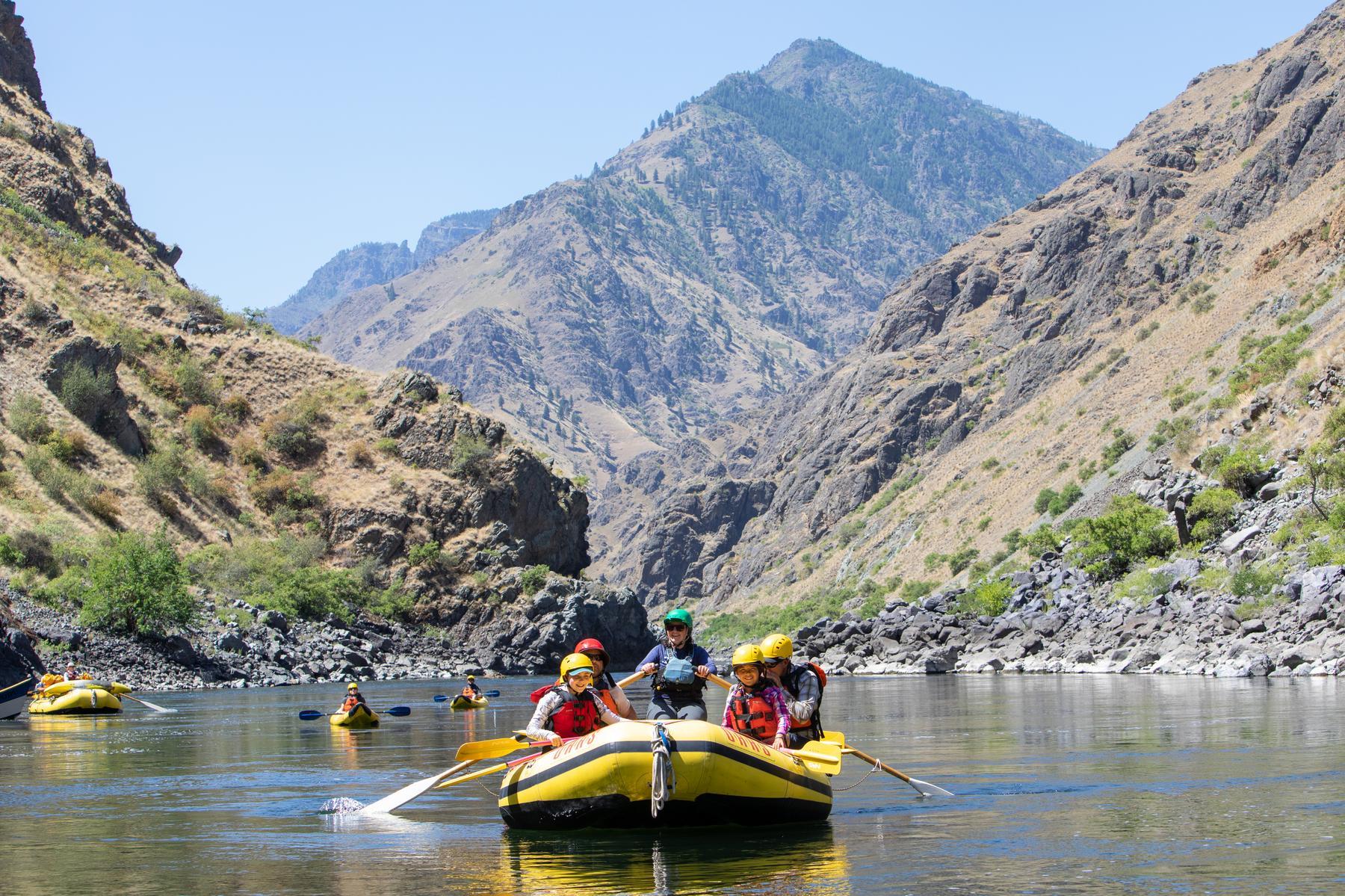 A group of OARS rafters floating on a scenic stretch of the Snake River in Hells Canyon