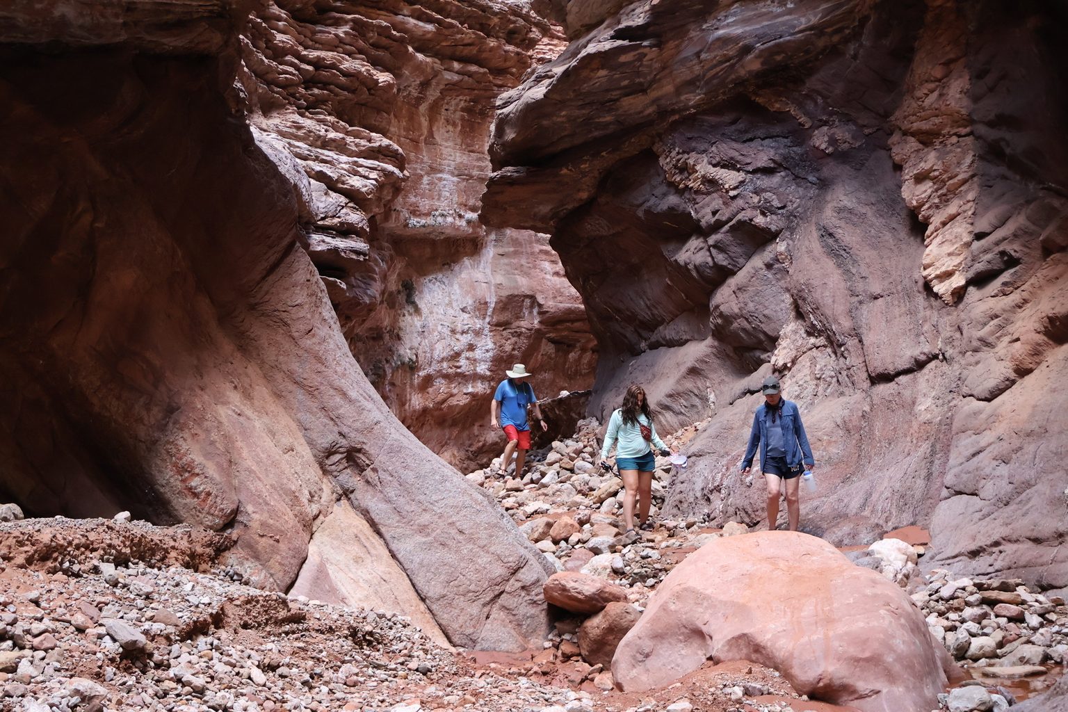 A few rafters exploring Blacktail Canyon, a popular side hike for river runners.